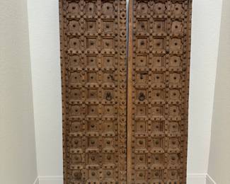These solid wood Vintage Doors with all the iron hardware detail are show stoppers! Stand approximately 6’. 