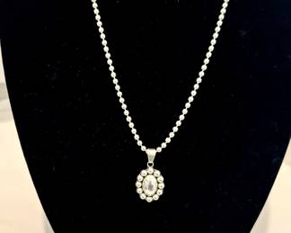 925 Silver necklace, earrings, and ring.