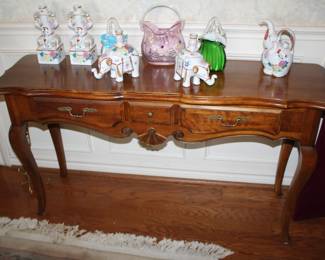 console table; Asian porcelains and Murano