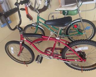 Two 1970's Schwinn Sting Ray bikes. Red bike is a model J38-8. I believe the Green is the Fair Lady