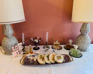 Pair of mid-century speckled table lamps, vintage perfume bottles, dainty embroidery artwork, brass candlestick holders, Fenton glass, vintage earring stand