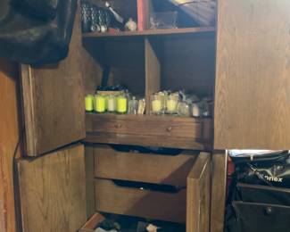Armoire filled with candles on top and men’s socks in bottom three drawers (new and used)