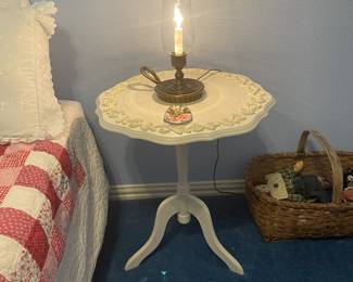 Tripod table with scrolled edges