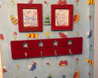 Red picture frames and cute star towel holder.