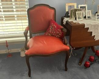 Red leather arm chair with nail head finish
