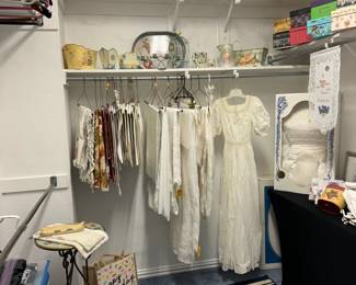 1910's wedding dress, 1999 wedding dress preserved in sealed box (size 16), many beautiful table linens and other pretty home decor.