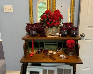 Many photo frames and candle holders.