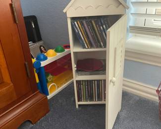 CDs in cute white house holders