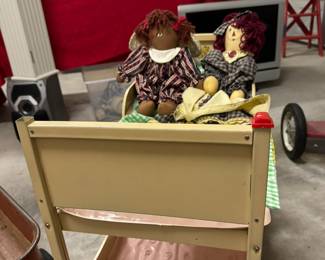 Vintage doll bunk bed with handmade 'raggedy-Anne' style dolls.