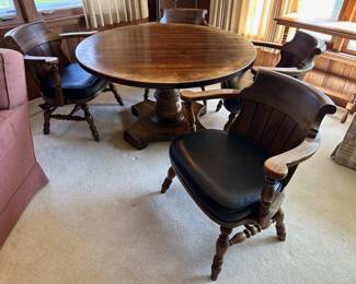 Vintage round wood table with 4 captains chairs 