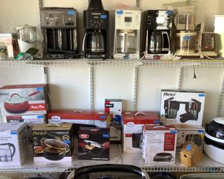 Many kitchen appliances with some still in the box, never used.