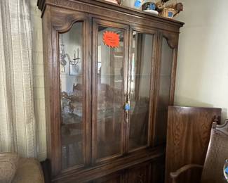 Vintage china cabinet with matching oval dining and 6 chairs.