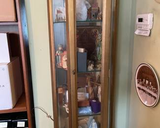 . . . curio cabinet filled with vintage icons