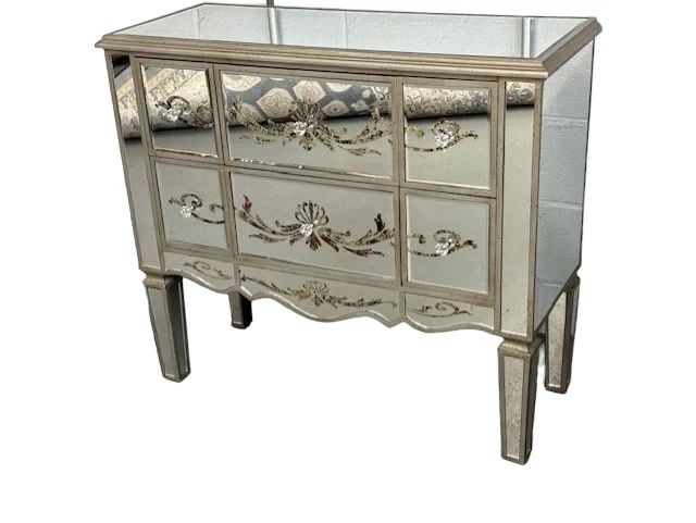 $320 USD    Privilege Mirrored Ornate Hollywood Silver 6 Drawer Dresser EK221-103    Indulge in luxury.  Featuring a striking mirrored finish and intricate ornate details, this dresser exudes elegance and sophistication.  The 6 drawers provide ample storage for your belongings in a bedroom or foyer.
Dimensions: 36 x 14.5 x 32"H
Condition: Very good condition.  
Local pick up Merrifield, VA.  Please contact us for shipper suggestions      https://goodbyhello.com/products/copy-of-turkish-knotted-blue-kaftan-izmir-area-rug-ek221-102?_pos=21&_sid=2469c3f2f&_ss=r