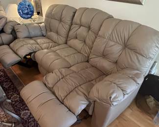 $ 350 each one of two matching faux leather Taupe reclining sofas reclining push buttons on both ends ( one has loose button and slight tear on side 85W x 34D x 40H