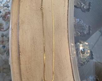  $250 14kt gold chain with nautical pendant 