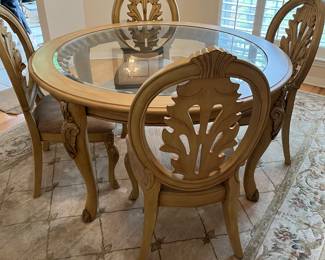 $450 Ashley Furniture round table with glass top and carved details 55 x 28 H 4 chairs with upholstered seats 21W x 17D x 41 H