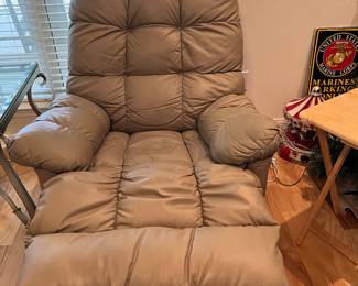 $ 120  one of two Taupe faux leather manuel recliner and rocker 34W x 35D x 42H 2nd recliner has damaged left arm rest and is $80