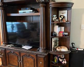 $750 Entertainment center 59W x 27D x 90H with two matching curved corner shelves 13W x 13D x 71H and two matching glass front cabinets 23W x 17D x 74H