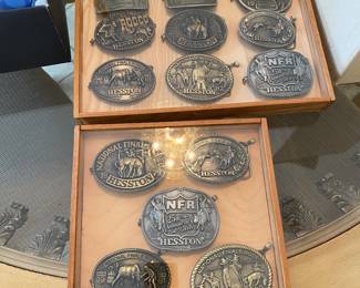 $60 Heston collection of 5 belt buckles in shadow box $90 Heston collection of 9 belt buckles in shadow box