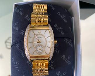 $180 - bulova lady’s watch with original box, rounded tank style 