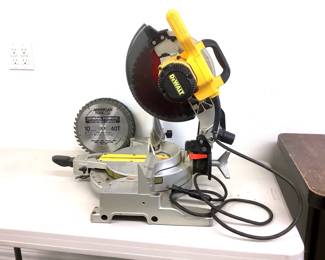 NIAB201 Dewalt Compound Miter Saw Model # DW713. Has the safety guard and was tested and works. Comes with a few used 10" blades.
