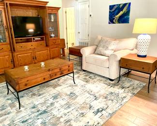 Nice Entertainment Center. Matching Iron and Wood Coffee Table and Matching End Table plus Sofa Table. All have Storage!