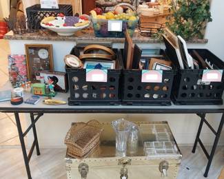 picture frames, plastic fruit, trunk, golf