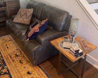 *Leather reclining loveseat 68” long. 
*Brant iron and wood side table