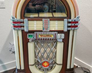 Wurlitzer One More Time Juke Box with 45’s and remote. 5 ft tall x 3 ft wide. 