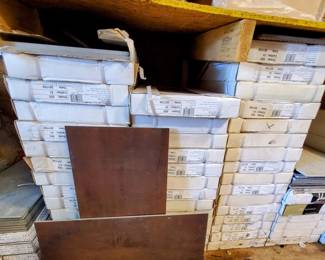 Several batches of tile that would be enough for a room