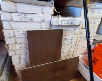 Several batches of tile that would be enough for a room