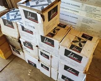 Several batches of tile that would be enough for a room