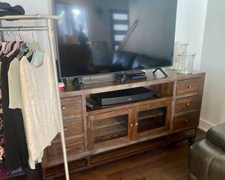 *Industrial style Cradenza on wheels, 
76” long, 38” tall, 18” deep
*samsung 58” flat screen smart tv 
model: UN58NU710DF 