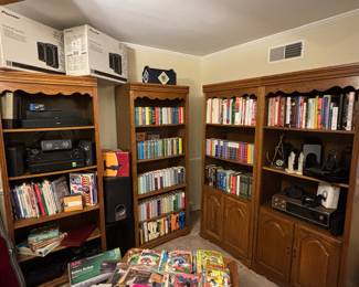 Bookshelves, books, comics, Bose speakers, receivers, electronics 