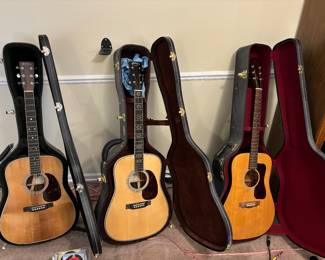 From left to right Martin & Co. D-35E 50th anniversary acoustic guitar SN:1925071, Martin & Co. HD-35 CFM IV 60th #3 0f 60 made SN:1906208, and a Guild model D3
