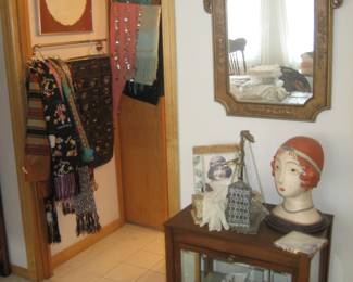 Ornate gold mirror, wood and glass display cabinet, vintage accessories, scarves and shawls