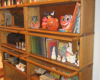 Pair of barrister bookcases in excellent condition, vintage paper maché Halloween masks, vintage books, some first editions