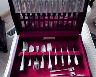 Sterling silver flatware (not in original box) and chest