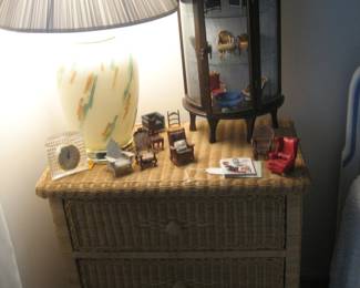 Natural wicker nightstand, table lamp, collectible miniature chairs and curio display cabinet