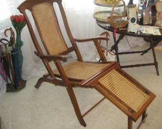 Rare folding ship's deck chair, folding table, and brass umbrella stand and umbrellas