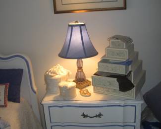 French provincial bed and nightstand, vintage lamp, framed botanical
