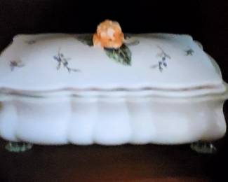 lift the lid and it's a flower frog. Trim stems of a bouquet and place in each of the interior holes to make a beautiful arrangement