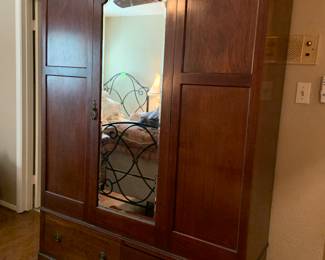 antique wardrobe with mirrored door