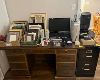Office desk, file cabinet, Dell computer set and lots of picture frames