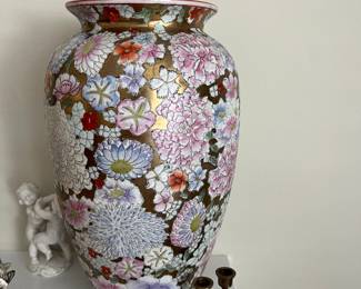 There are 2 matching Maitland Smith Vases