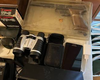 binoculars and airsoft gun