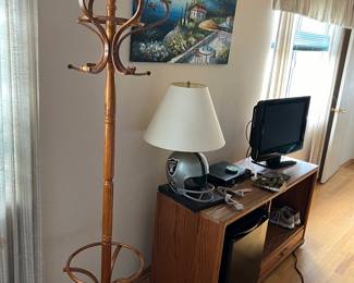 vintage coat hanger + media cabinet + small tv