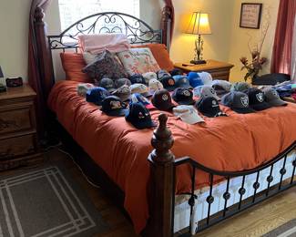 bed with a heated mattress, lots of hats