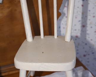 there is a grouping of vintage childs furniture painted white. very charming. 